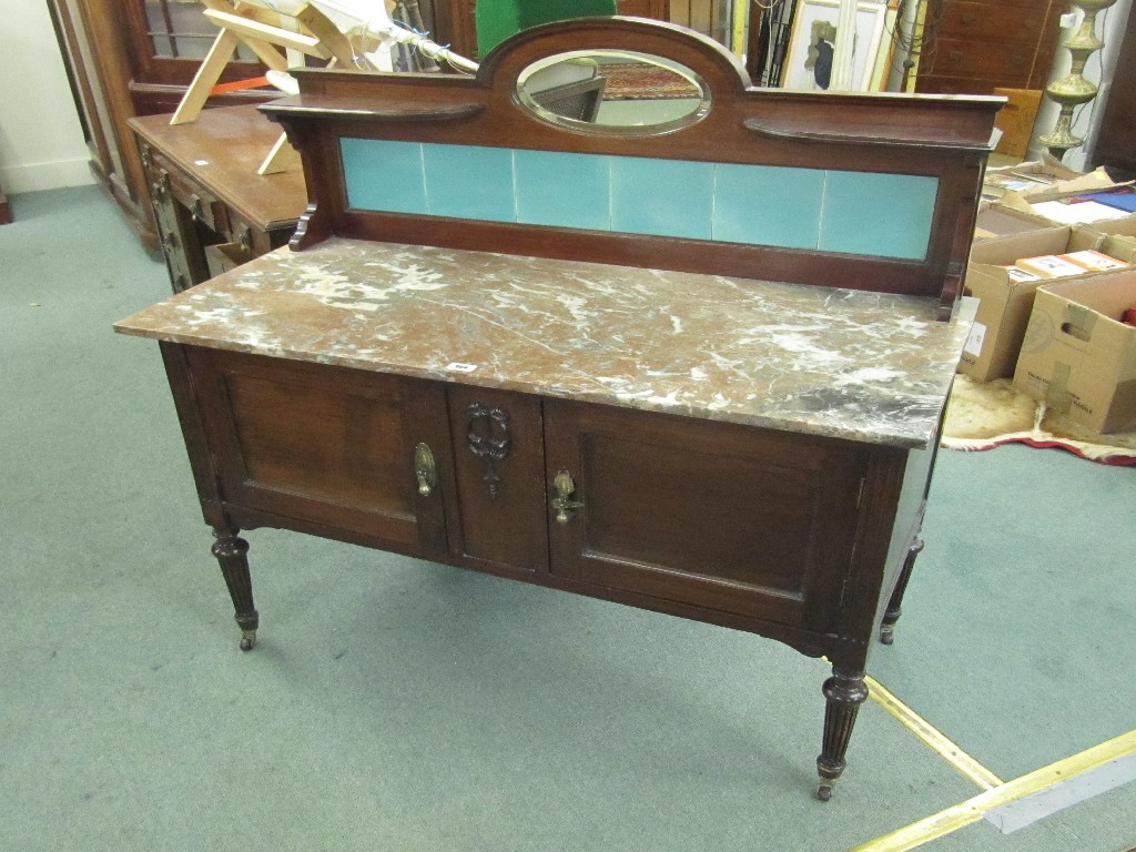 Appraisal: Victorian style mahogany washstand with tiled back and marble top