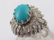 Appraisal: A white metal tests carat gold turquoise and diamond ring