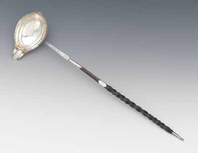 Appraisal: A British Toddy Ladle by Andrew Fogelberg London Engraved oval