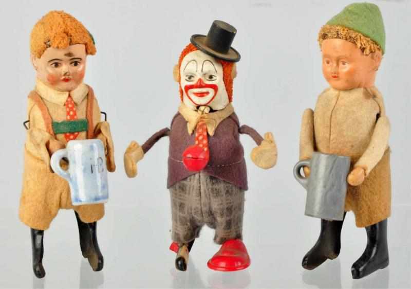 Appraisal: Lot of Felt-Covered Schuco Wind-Up Figures German Includes two beer