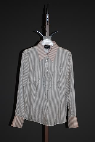 Appraisal: Giorgio Armani ivory silk long sleeve blouse with shirt collar