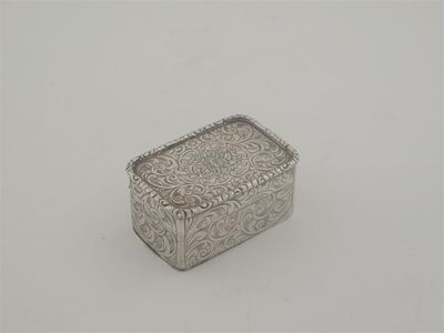 Appraisal: A Victorian oblong nutmeg grater with scrollwork engraving with two