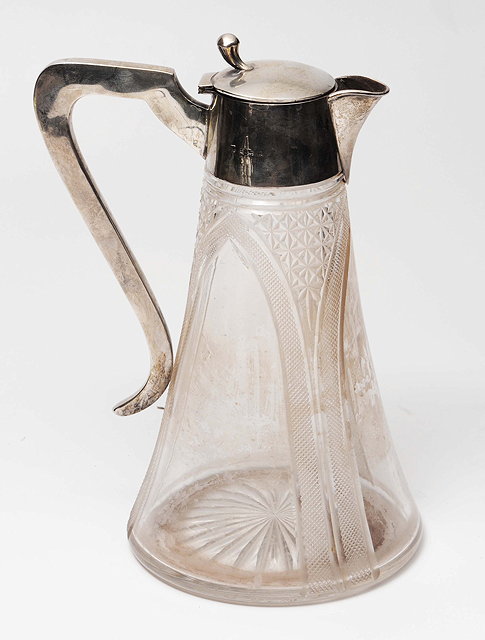 Appraisal: A SILVER MOUNTED GLASS CLARET JUG of tapering form with