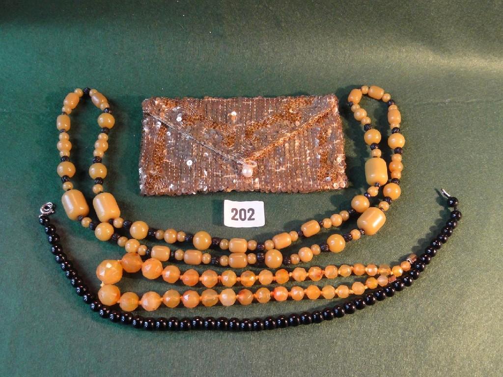 Appraisal: Several strings of various hard stone beads together with a