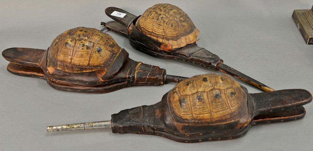 Appraisal: Three primitive turtle shell and leather bellows lg '' one