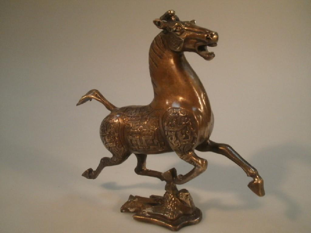 Appraisal: A Chinese bronze horse on a bird base