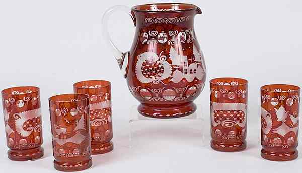 Appraisal: Bohemian Ruby Water Set Bohemian a ruby glass pitcher and