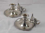 Appraisal: A pair of Italian standard silver chambersticks with extinguishers by