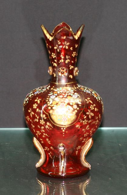 Appraisal: Victorian ruby glass baluster vase with enamelled and gilded decoration