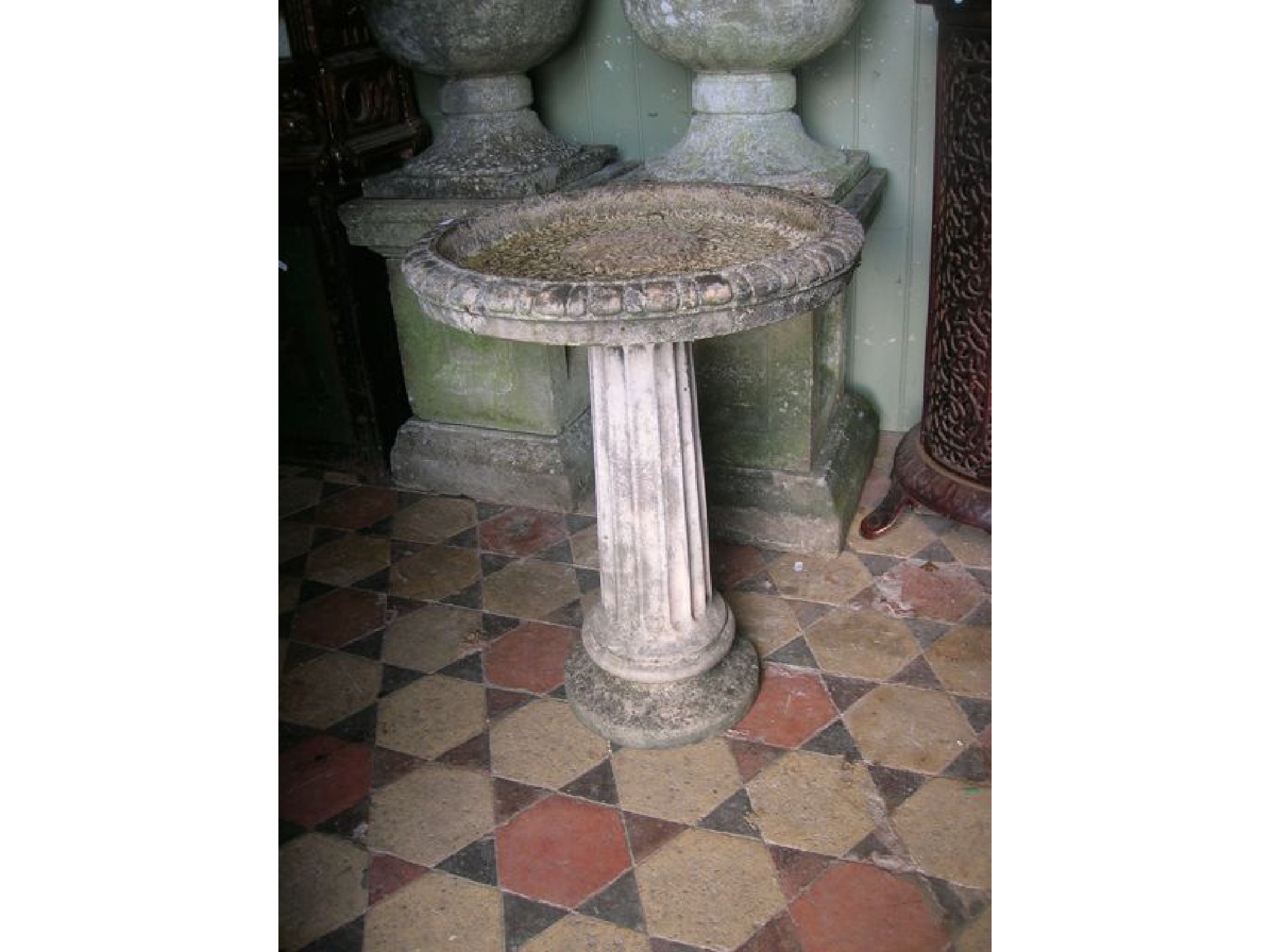 Appraisal: A weathered contemporary cast composition stone two sectional bird bath