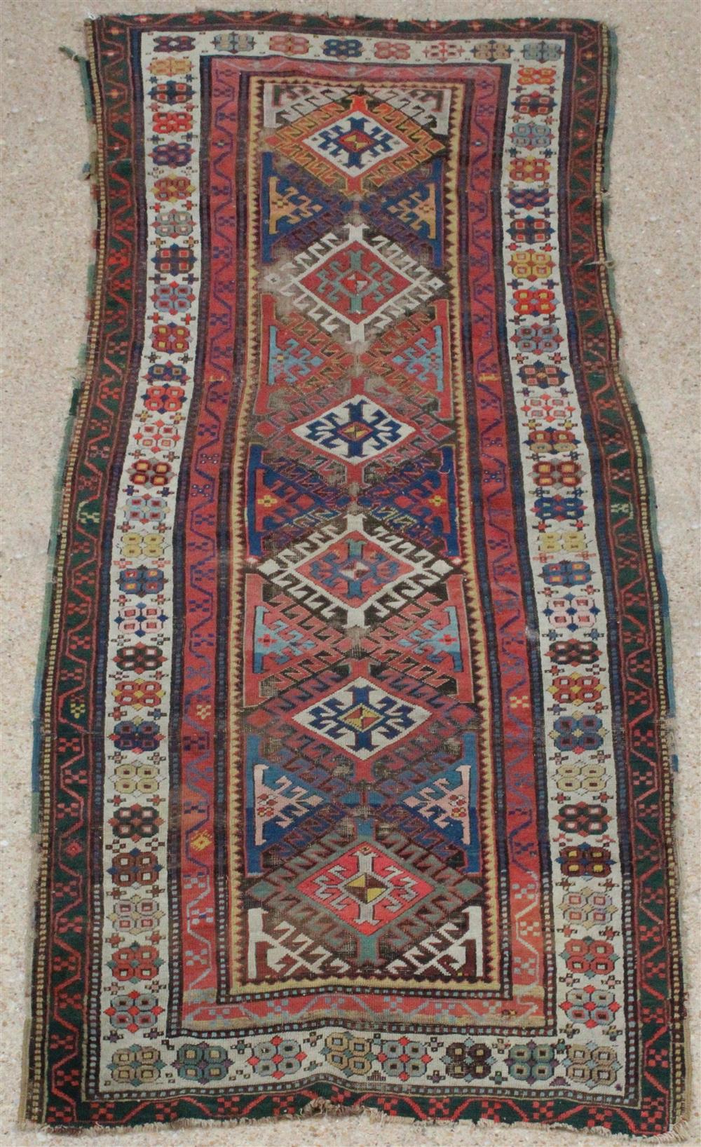 Appraisal: CAUCASUS TRIBAL WOOL RUNNER geometric design colors include orange blue