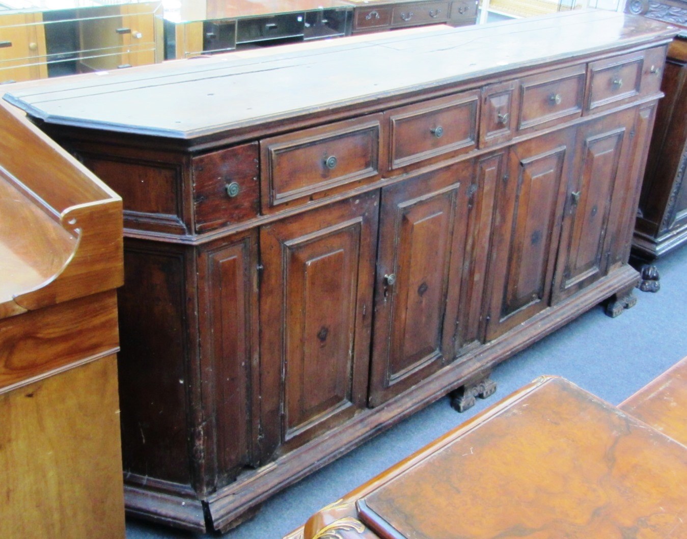 Appraisal: A th century Italian walnut and chestnut buffet with seven