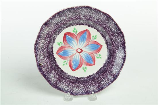 Appraisal: SPATTERWARE PLATE England nd quarter- th century Purple paneled plate