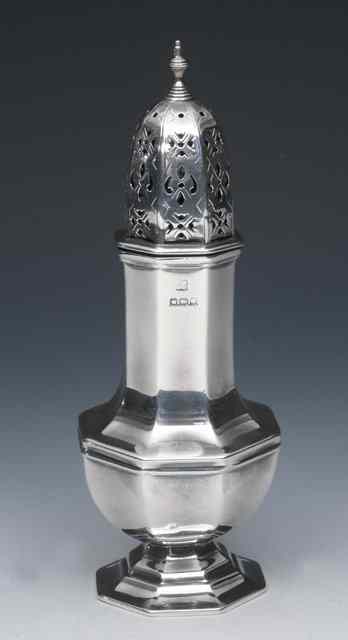 Appraisal: A SILVER OCTAGONAL BALUSTER SHAPED SILVER CASTOR with matching foot