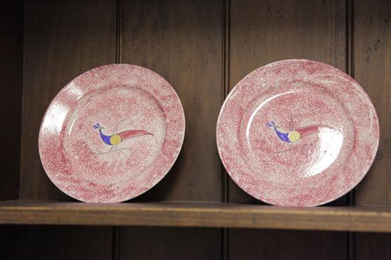 Appraisal: TWO SPATTERWARE PLATES Similar red spatter plates both with peafowl