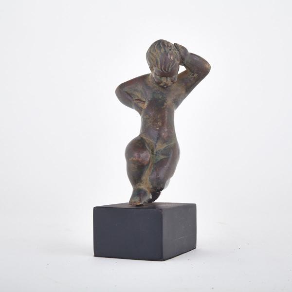 Appraisal: Patinated Bronze Figure of a Putti th century on ebonized