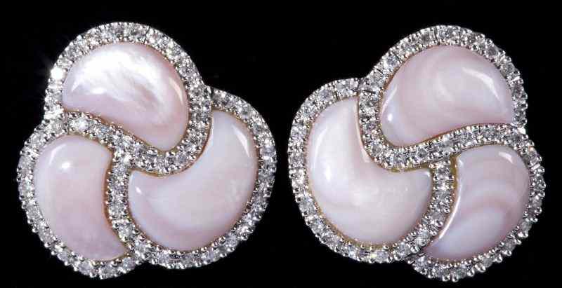 Appraisal: Pair of Diamond and Mother -of-Pearl Earclipsdesigned in a swirl