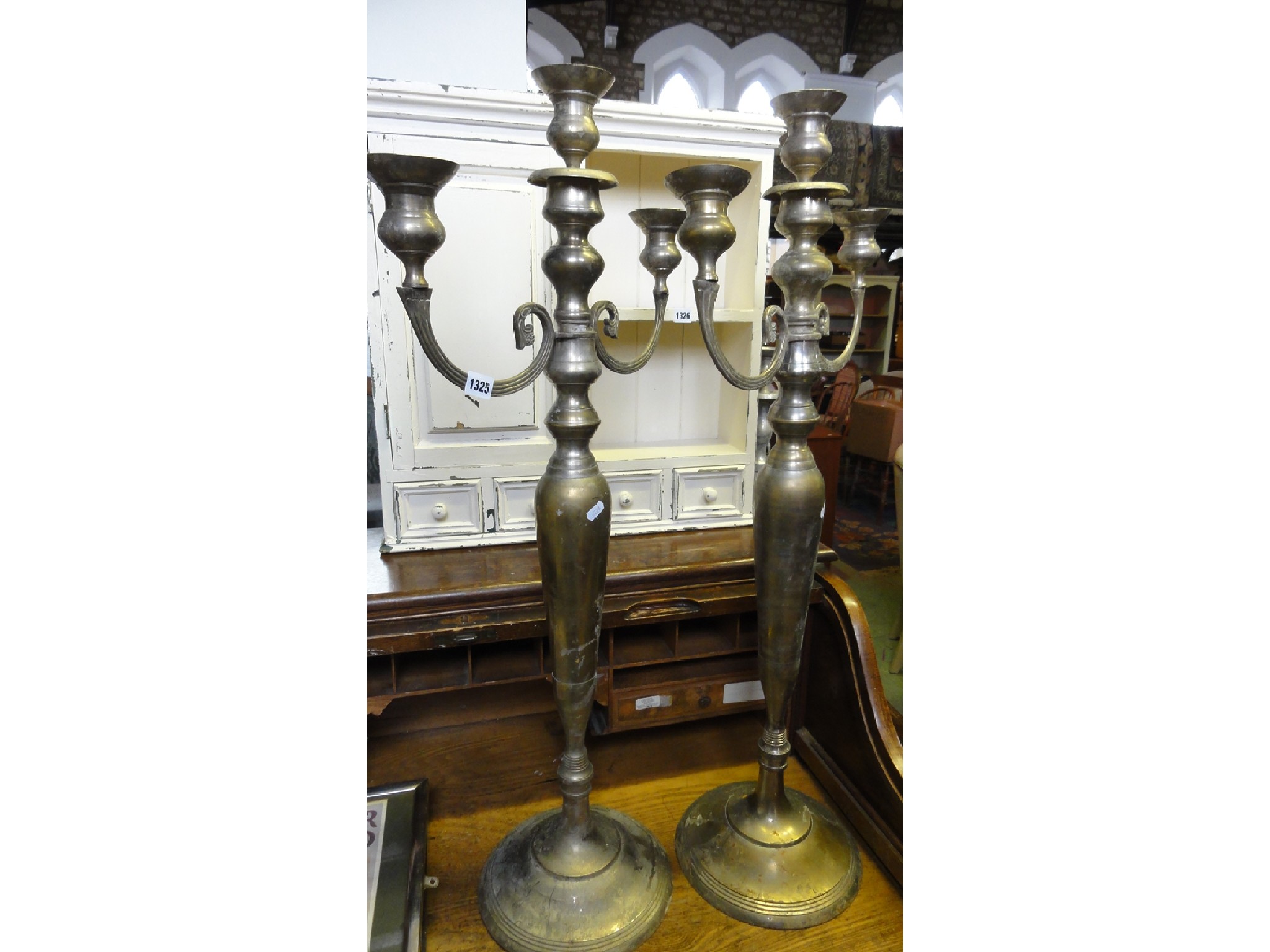 Appraisal: A pair of large cast metal three branch candelabra with