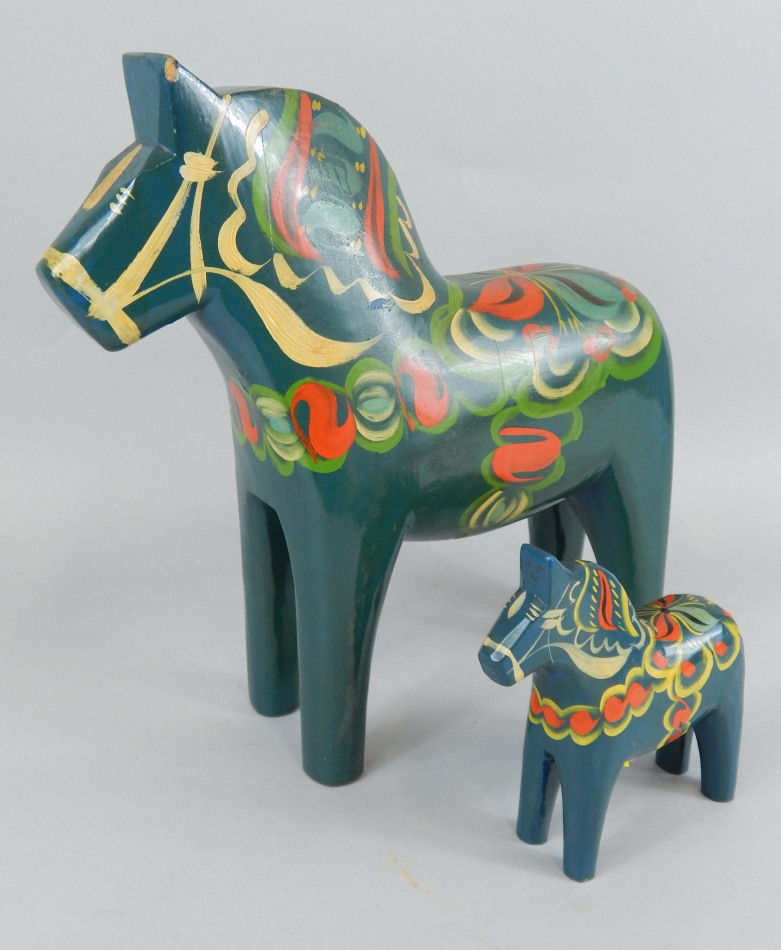 Appraisal: A Nils Olsson Swedish folk art painted horse and another