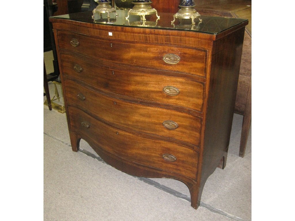 Appraisal: Mahogany serpentine front drawer chest with shaped apron