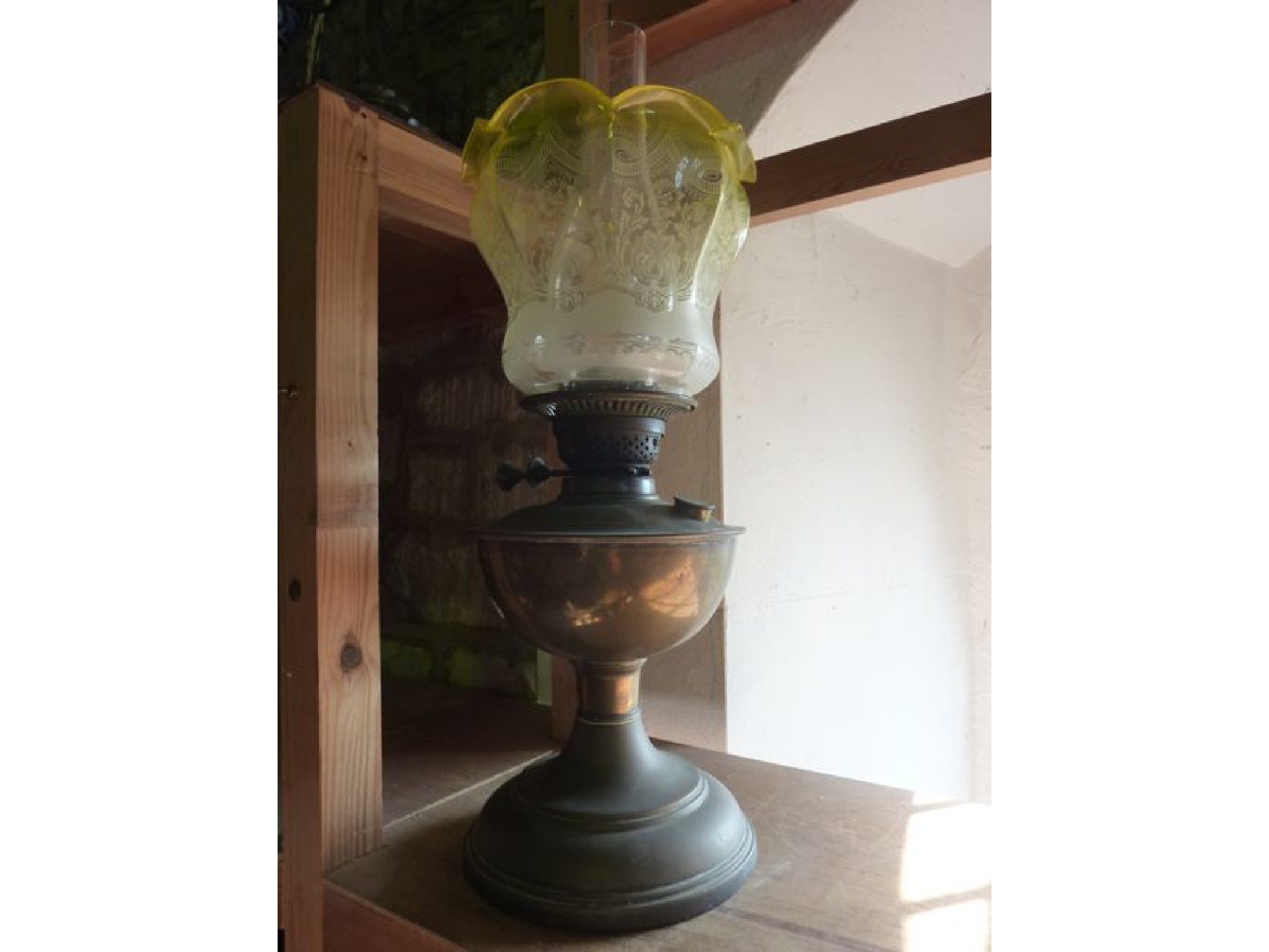 Appraisal: A brass oil lamp with British made burner supporting a