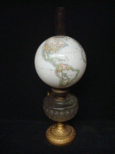 Appraisal: Oil Lamp with Atlas Glass Globe From a Greenwich CT