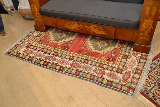 Appraisal: PERSIAN RUG IN RED GREEN CREAM AND BLUE TONES