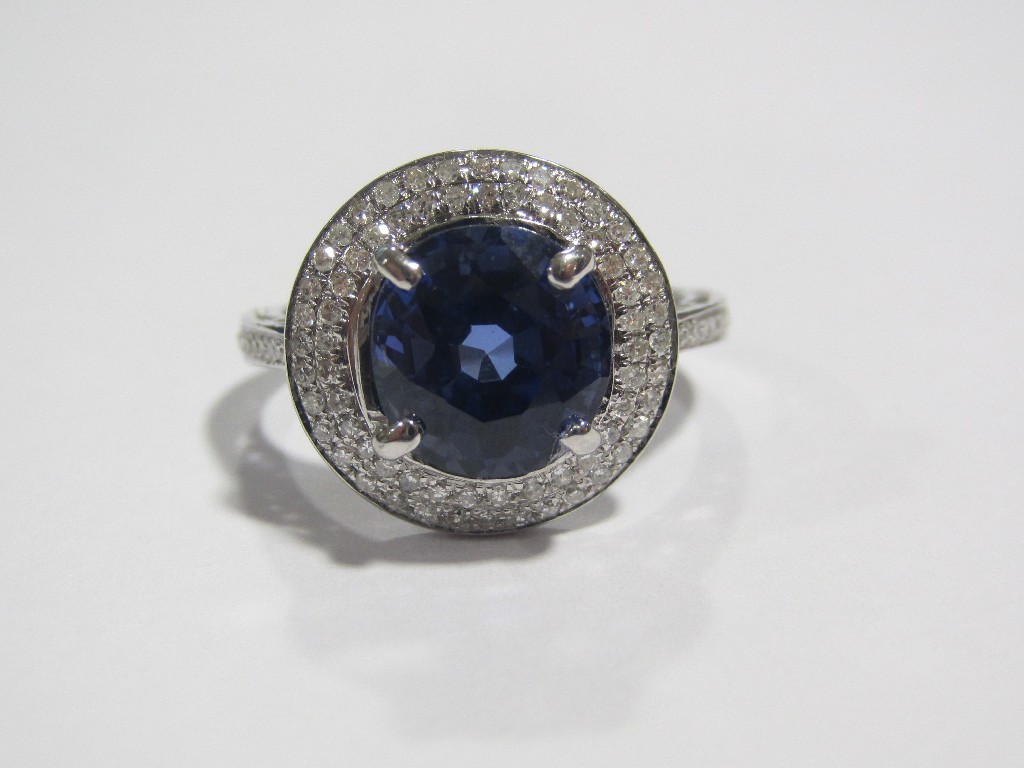 Appraisal: White gold sapphire and diamond cluster ring with oval cut