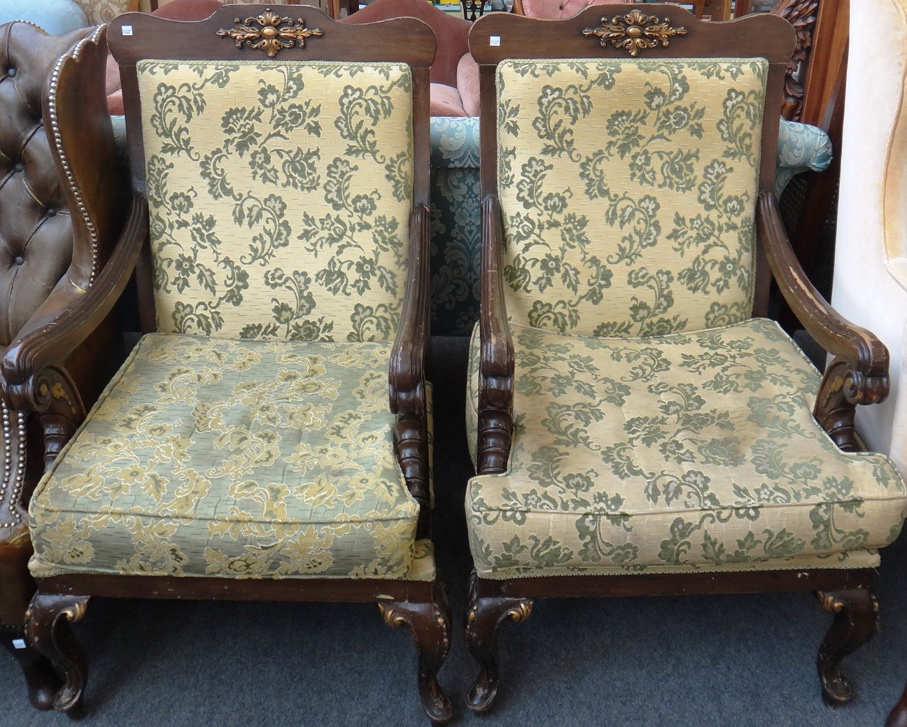 Appraisal: A pair of parcel gilt mahogany open armchairs of neoclassical