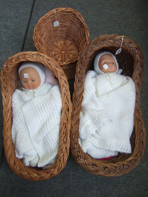 Appraisal: Two small wicker cradles and a wicker dolls chair the