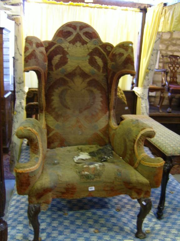 Appraisal: An Edwardian Georgian style wing armchair of extravagant form with