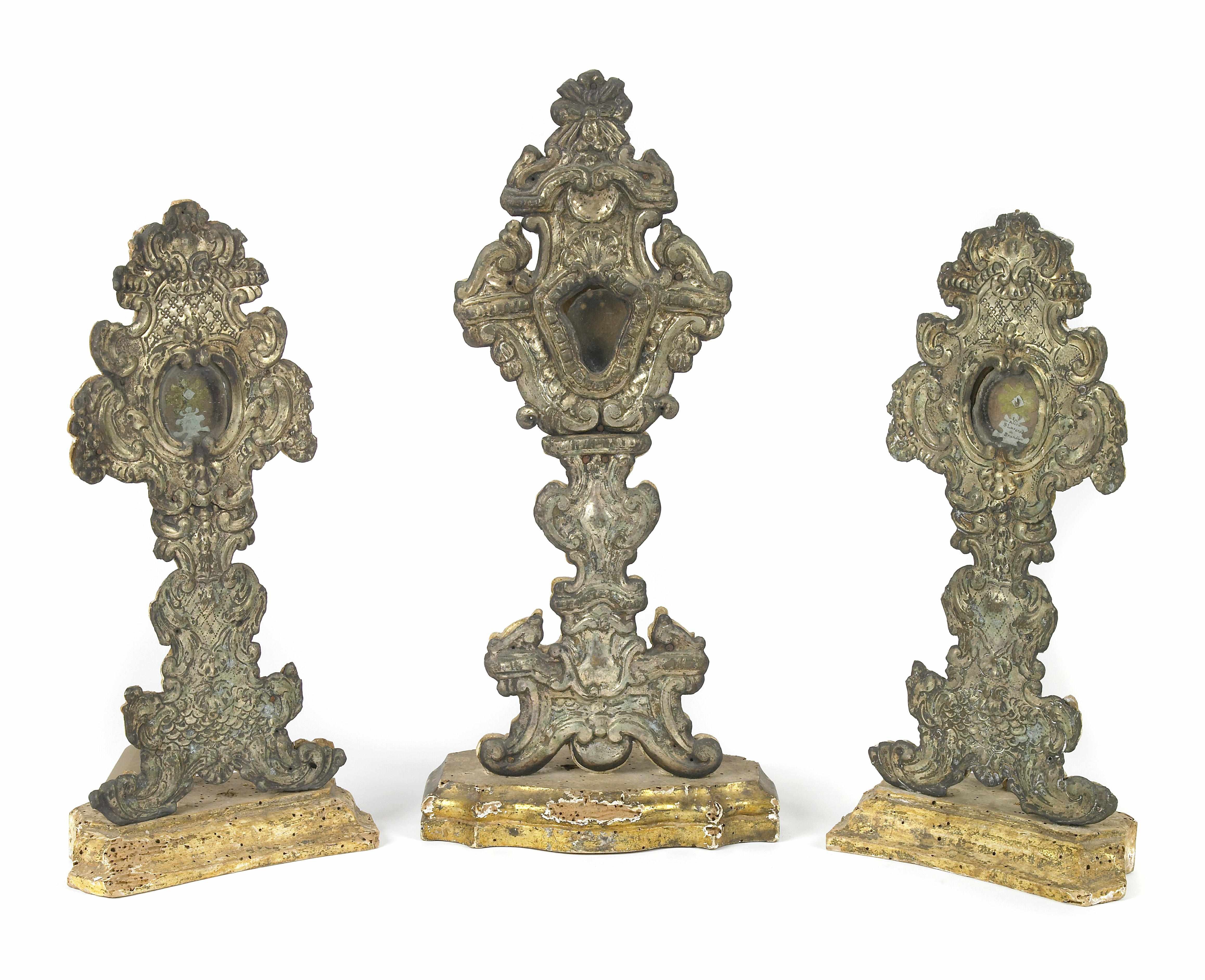 Appraisal: A group of three Italian silvered metal monstrances on wooden