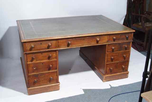 Appraisal: A LARGE VICTORIAN MAHOGANY PEDESTAL PARTNERS DESK with green leather