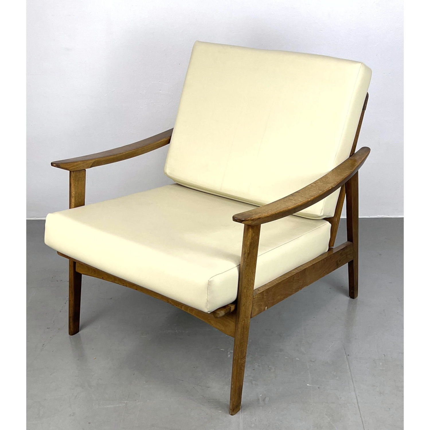 Appraisal: Modernist Sloped Open Arm Lounge Chair Spindle back Cream vinyl