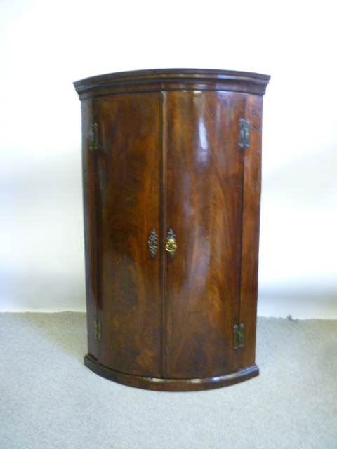 Appraisal: A GEORGE III MAHOGANY HANGING CORNER CUPBOARD c of bowed