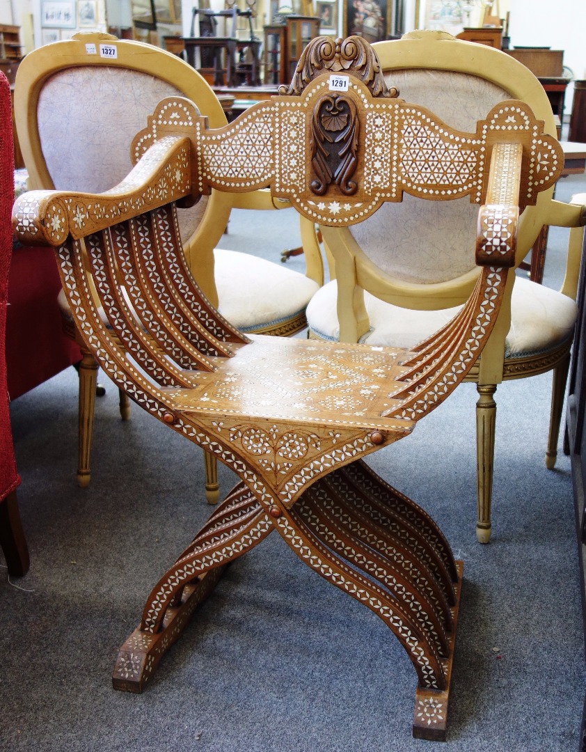 Appraisal: A th century Italian bone inlaid walnut Savonarola chair