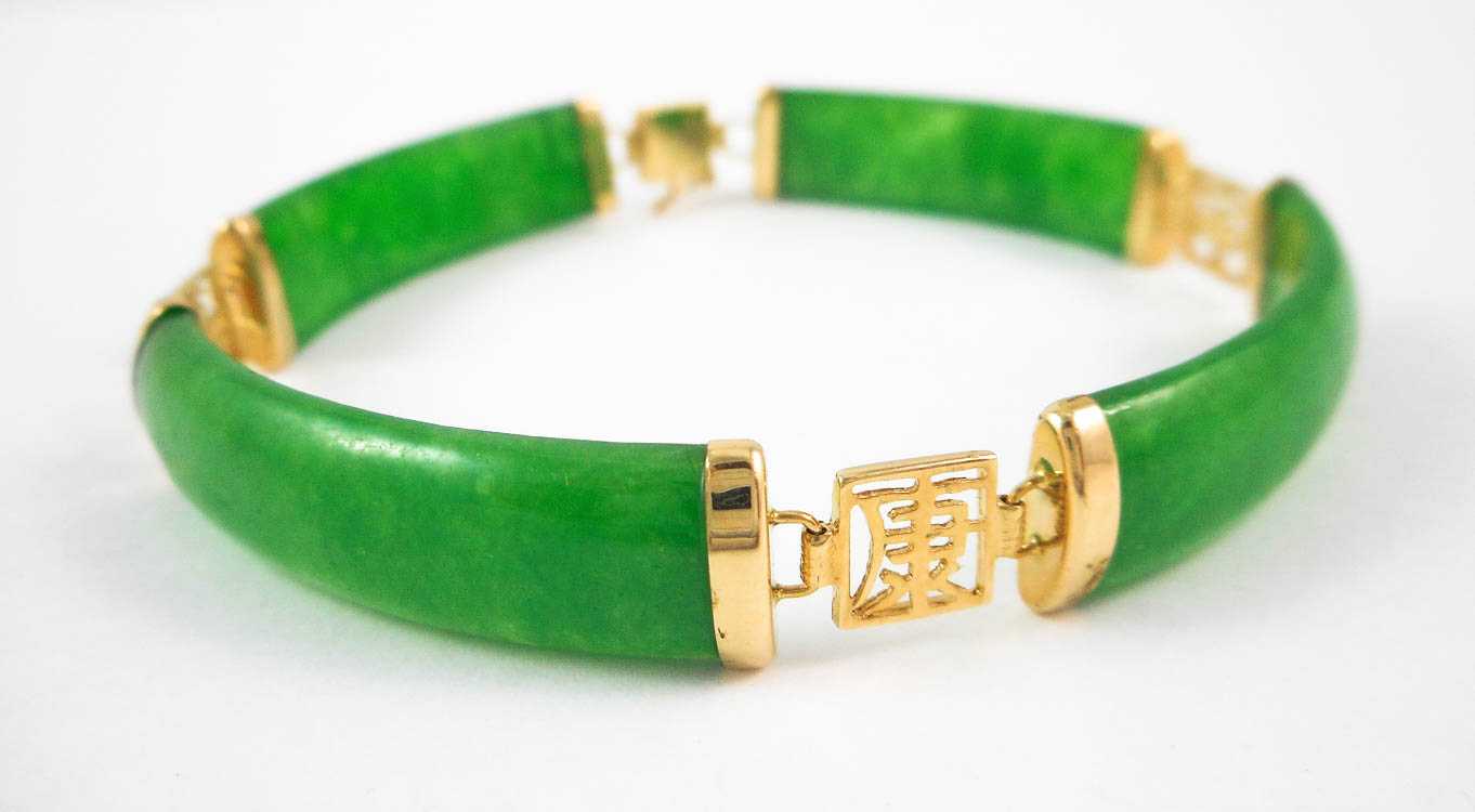 Appraisal: CHINESE JADE AND FOURTEEN KARAT GOLD BRACELET measuring inches in