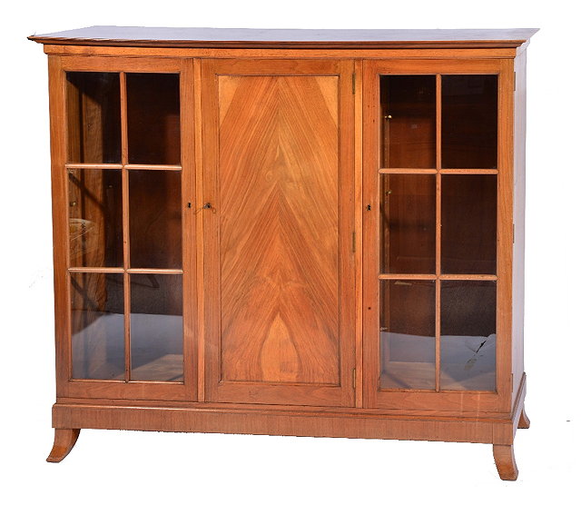 Appraisal: Walnut bookcase by John Starkprobably retailed by Heals having central