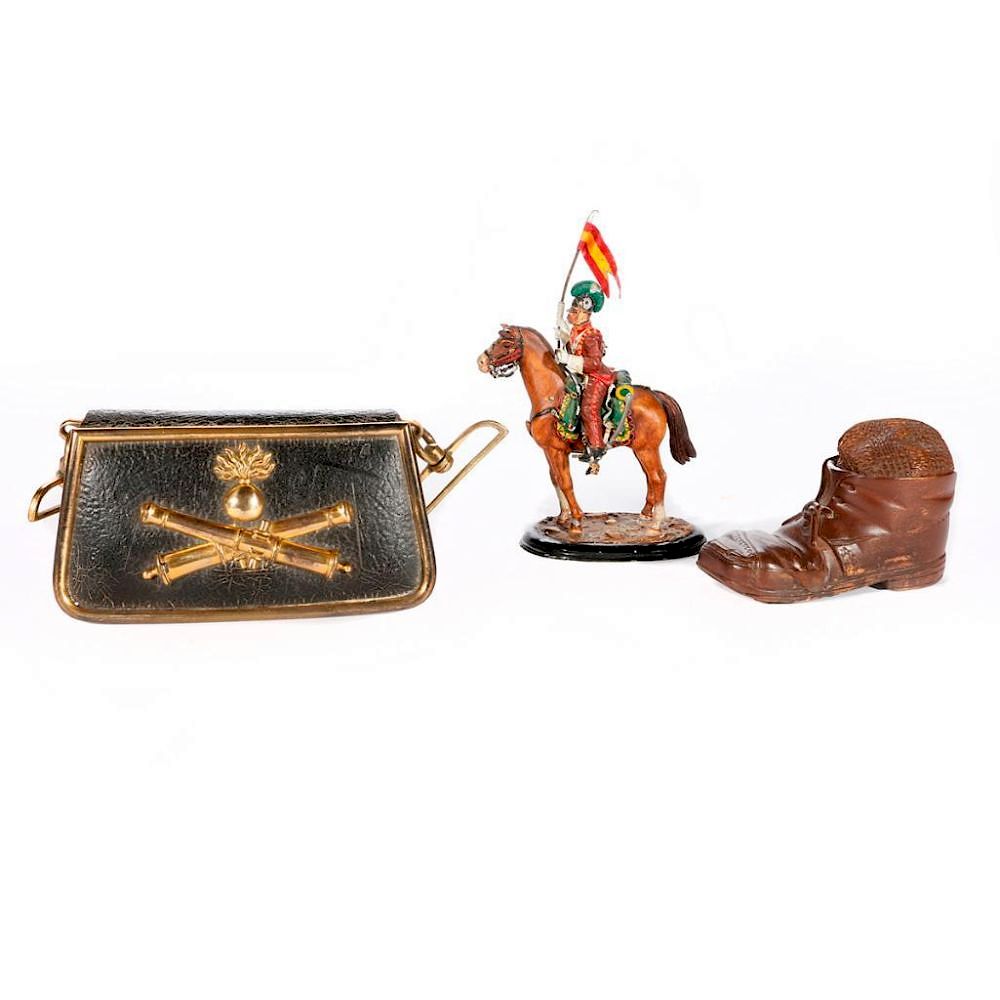 Appraisal: A cast French toy soldier a tobacco box and an