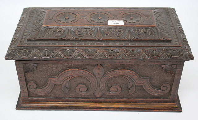 Appraisal: A TH CENTURY CARVED OAK BOX with scrolling decoration cm