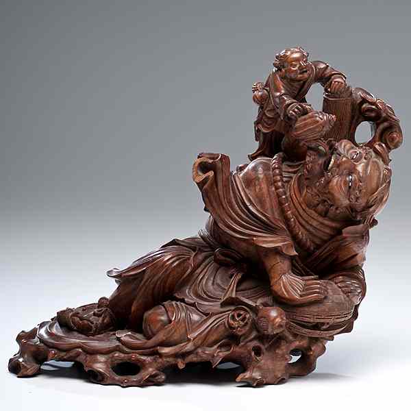 Appraisal: Chinese Boxwood Carving Chinese A boxwood carving of a lounging