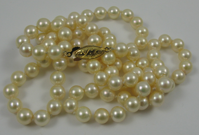 Appraisal: PEARL AND SILVER NECKLACE in length and strung with round