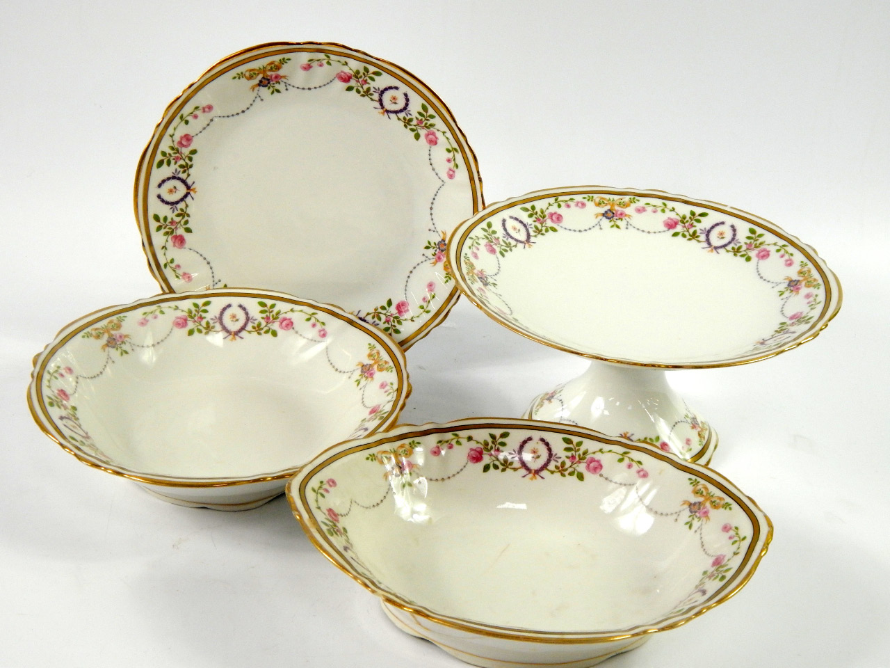 Appraisal: A Limoges porcelain dessert service thC decorated with flowers comprising