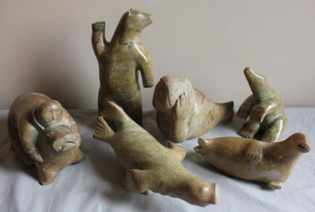 Appraisal: Piece Inuit Animal Carving Lot Includes a man riding a