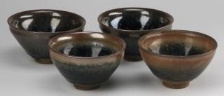 Appraisal: Chinese hare's fur tea bowls h Four Chinese Song style