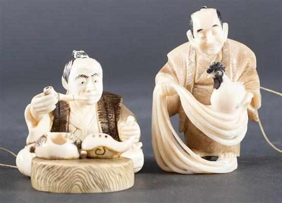 Appraisal: Two Japanese carved ivory netsukes man holding a rooster and