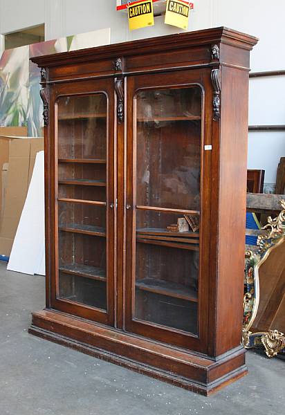 Appraisal: A Renaissance Revival walnut bookcase bearing brass plaque inscribed The