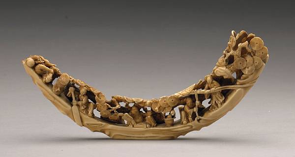 Appraisal: A reticulated marine ivory tusk The hollow crescent shaped tuck