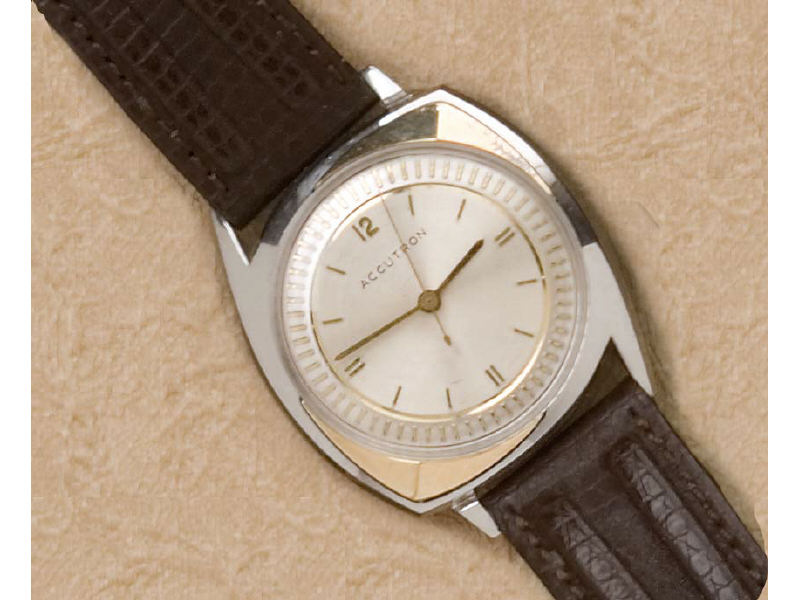 Appraisal: ACCUTRON WATCH Stainless steel with yellow trim and fluted design