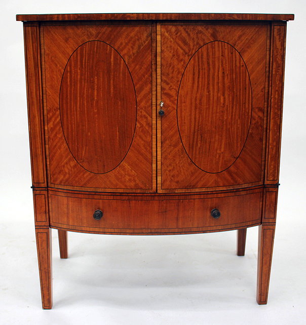 Appraisal: A GEORGIAN STYLE SATIN WOOD BOW FRONTED SIDE CABINET with